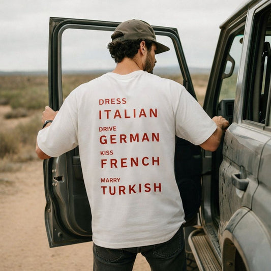 Dress Italian, Drive German, Kiss French, Marry Turkish Unisex T-Shirt